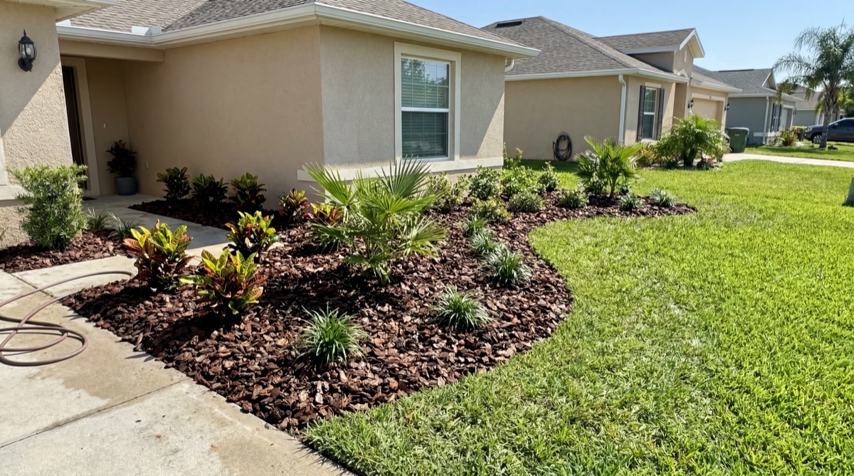 Mulch bed installation on Florida home front yard in College Park